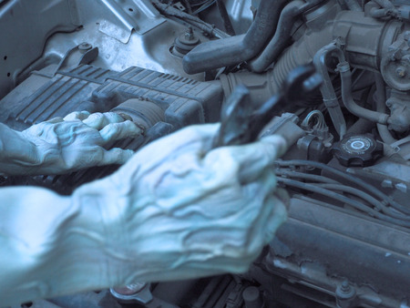 Auto mechanic zombie working in garage. Repair service .halloween .