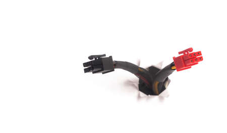 Computer cable isolated on white background. Moving through the hole. Internet support concept.