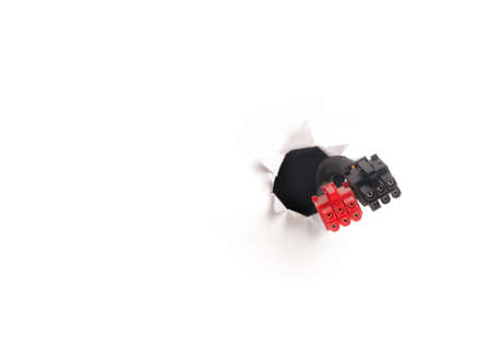 Computer cable isolated on white background. Moving through the hole. Internet support concept.