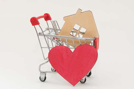 The shopping cart contains a sketchy house and a red heart next to it. The idea is to buy a home...
