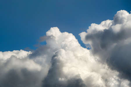 beautiful clouds in the blue sky, illuminated by sunlight. Horizontal photo.の写真素材