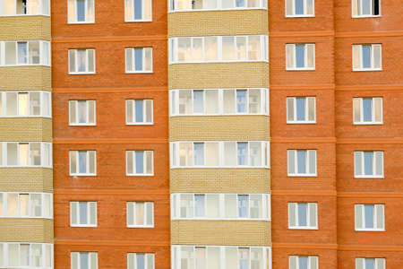 windows of an apartment and high-rise building close-up.
