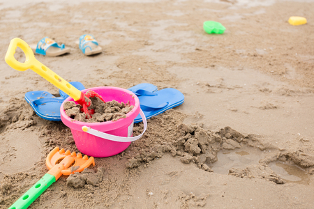 Kids toys on tropical sand beachの写真素材