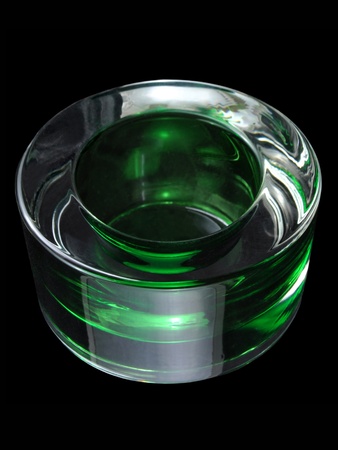 Lighting effects in a candlestick made of green glassの写真素材