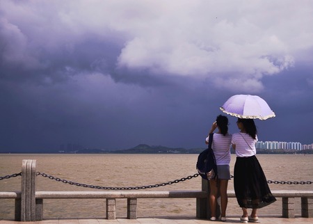 two girl taking picture at outdoor.のeditorial素材