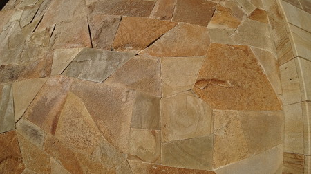 Wall of decorative stone on a sunny day
