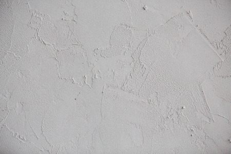 Plaster white wall. Grunge old peeled surface with shabby structure frame background. Whitewashed texture. Plastered shabby rustic wall background, copy spaceの写真素材