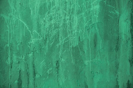 Plaster green wall. Grunge old peeled surface with shabby structure frame background. Whitewashed...