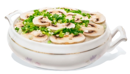 Homemade Mushroom soup with onion isolated on white backgroundの写真素材