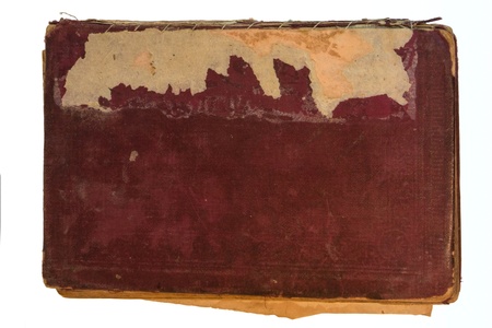 Old red textile cover of hand-written book isolated on white backgroundの写真素材