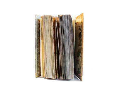 Old yellow notebook isolated on white backgroundの写真素材