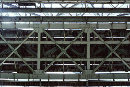 Beneath the Industrial Bridge, a captivating scene shows intricate designs of engineeringの写真素材