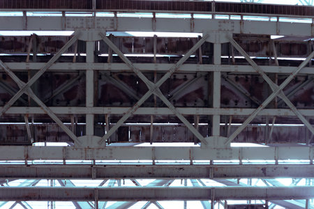 Beneath the Industrial Bridge, a captivating scene shows intricate designs of engineeringの写真素材