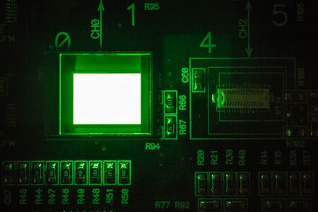 The process of checking several oled displays on the test station. Displays glow brightly of green color.Microelecronics.Display and light panel technology.の写真素材
