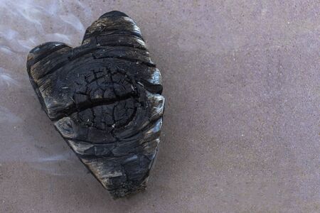 coals in a fire, coal in the form of heart .Smoke frome heart
