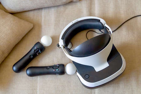 Moscow,Russia - April 12 2020 A playstation 4 VR headset together with a playstation 4 controller...