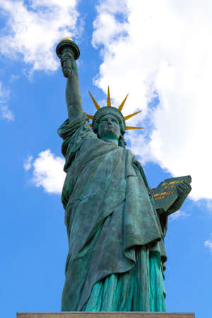 Paris, France - September 20, 2018: A replica of the iconic Statue of Liberty monument located by the Grenelle Bridge on the river Seine in Paris a cloudy day.Close up.のeditorial素材