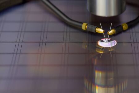 Checking microchips on silicon wafer with probe station.Close up . Semiconductor Crystal...