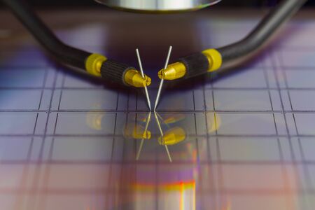 Checking microchips on silicon wafer with probe station.Close up . Semiconductor Crystal...