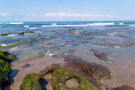 Stunning natural rock pools at Echo beach in Canggu, Bali, Indonesia.