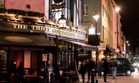 Traditional English Pub The Three Greyhounds in London SOHO district LONDON, ENGLAND - FEBRUARY 22, 2016のeditorial素材