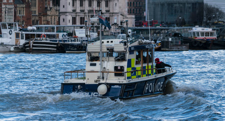Police Boat on River Thames LONDON, ENGLAND - FEBRUARY 22, 2016