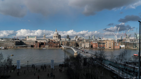 City of London skyline with Millennium Bridge and River Thames LONDON, ENGLAND - FEBRUARY 22, 2016のeditorial素材