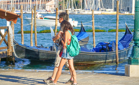 Young couple walking thorugh Veniceのeditorial素材