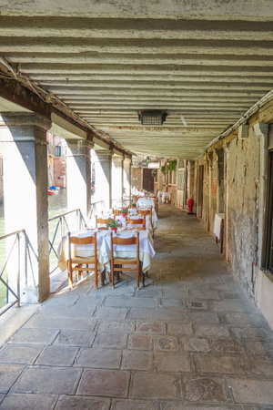 Small romantic restaurant located at the Grand Canal in Veniceのeditorial素材