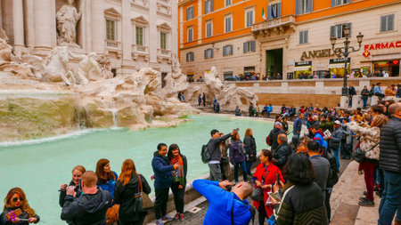 ROME / ITALY - NOVEMBER 6, 2016 - Crowd of tourists visiting the Fountains of Trevi in the historic district of Romeのeditorial素材