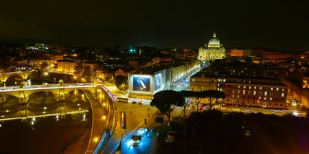 Aerial view over Vatican City and St Peters by nightのeditorial素材