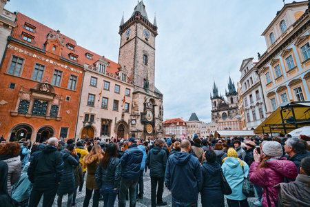 Tourists watching the famous astronomical clock in Prague - PRAGUE / CZECH REPUBLIC - MARCH 20, 2017のeditorial素材