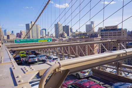 Street traffic on Brooklyn Bridge in New York- MANHATTAN / NEW YORK - APRIL 1, 2017のeditorial素材