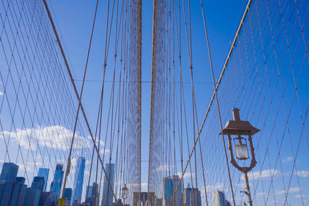 New York Brooklyn Bridge on a sunny day- MANHATTAN / NEW YORK - APRIL 1, 2017のeditorial素材