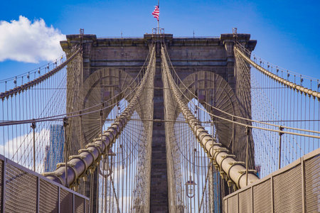 One of the main attractions in New York - famous Brooklyn Bridge- MANHATTAN / NEW YORK - APRIL 1, 2017のeditorial素材