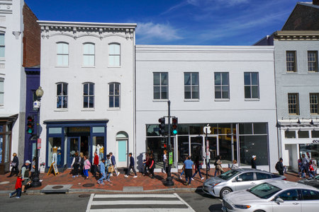 Tourists walking through Georgetown - a busy area in Washington - WASHINGTON DC - COLUMBIA - APRIL 7, 2017のeditorial素材