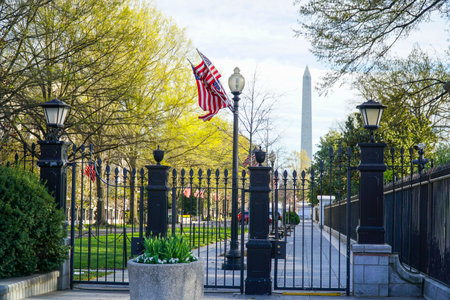 Gate to the White House with Washington Monument in the background - WASHINGTON DC - COLUMBIA - APRIL 7, 2017のeditorial素材