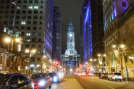 Philadelphia street view at night with city hall - PHILADELPHIA - PENNSYLVANIA - APRIL 7, 2017のeditorial素材