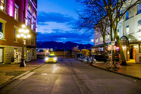 Amazing Vancouver Gastown district at night - the old town - VANCOUVER - CANADA - APRIL 12, 2017のeditorial素材