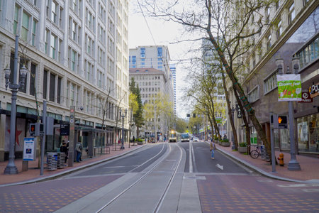 Street view in Portland with tram tracks - PORTLAND - OREGON - APRIL 16, 2017のeditorial素材