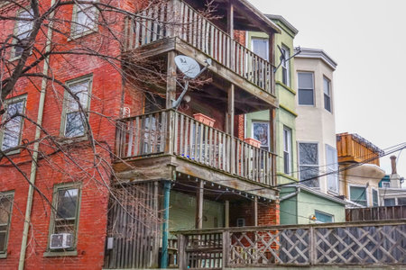 Wooden banconies at a brick house in Philadelphia - PHILADELPHIA / PENNSYLVANIA - APRIL 6, 2017のeditorial素材