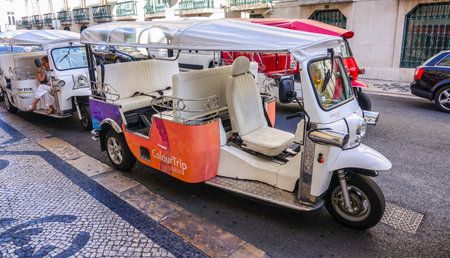 Famous Tuk Tuk Cars in the city of Lisbon - LISBON, PORTUGAL 2017