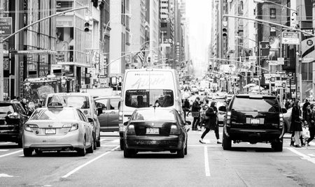Street traffic in New York - typical street view in Manhattan - MANHATTAN / NEW YORK - APRIL 2, 2017