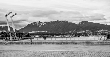 Beautiful Waterfront in Vancouver with the mountains of North Vancouver - VANCOUVER - CANADA - APRIL 12, 2017のeditorial素材