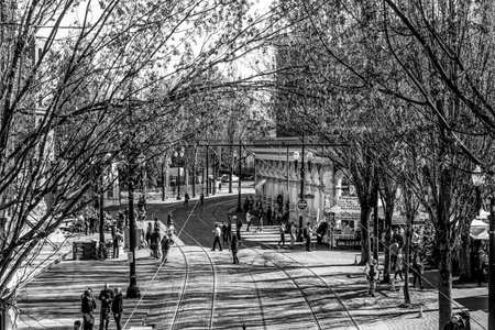 Portland street view with tram tracks on a sunny day - PORTLAND - OREGON - APRIL 15, 2017のeditorial素材