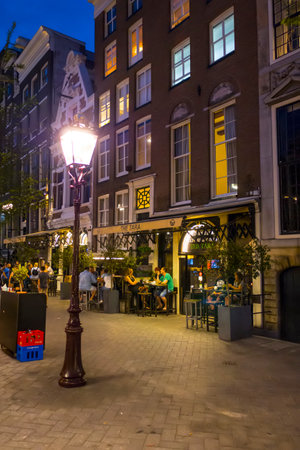 Street lanterns on the sidewalks in Amsterdam - evening view - AMSTERDAM - THE NETHERLANDS - JULY 20, 2017のeditorial素材