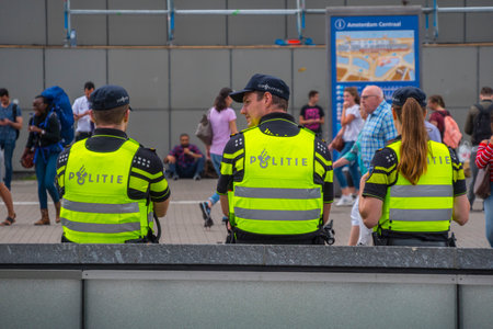 Amsterdam Police Officers at Central Station - AMSTERDAM - THE NETHERLANDS - JULY 20, 2017のeditorial素材