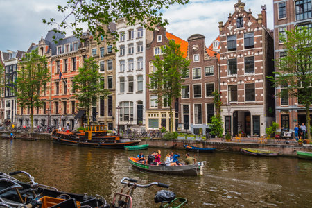 The amazing small houses at the canals in the city center of Amsterdam - AMSTERDAM - THE NETHERLANDS - JULY 20, 2017のeditorial素材