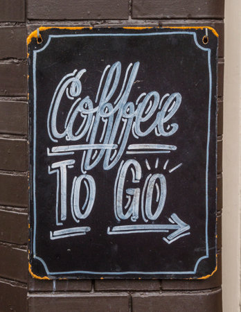 Coffee to go sign in the city of Amsterdam - AMSTERDAM - THE NETHERLANDS - JULY 20, 2017のeditorial素材