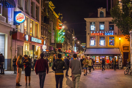 Colorful bars and restauramts at Leidse Square - a popular place in the eveningのeditorial素材